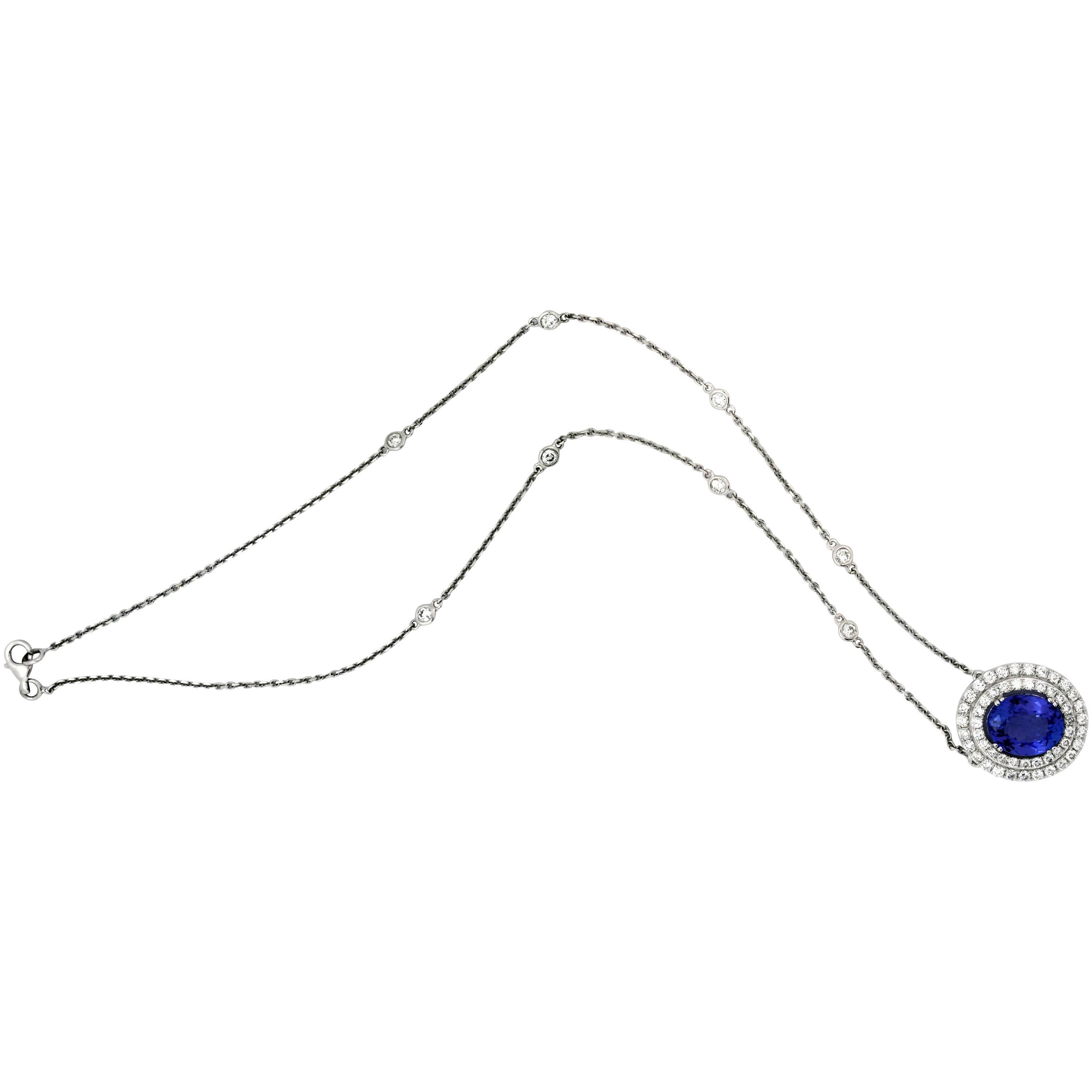 18K White Gold Pendant Necklace with Tanzanite Center and Diamonds

Center Tanzanite Pendant has double-row of diamonds.
Tanzanite: apprx. 1.35ct. Oval cut. Center pendant is 0.8 inch width.

Chain has 8 diamond bezels and measures 16 inches in