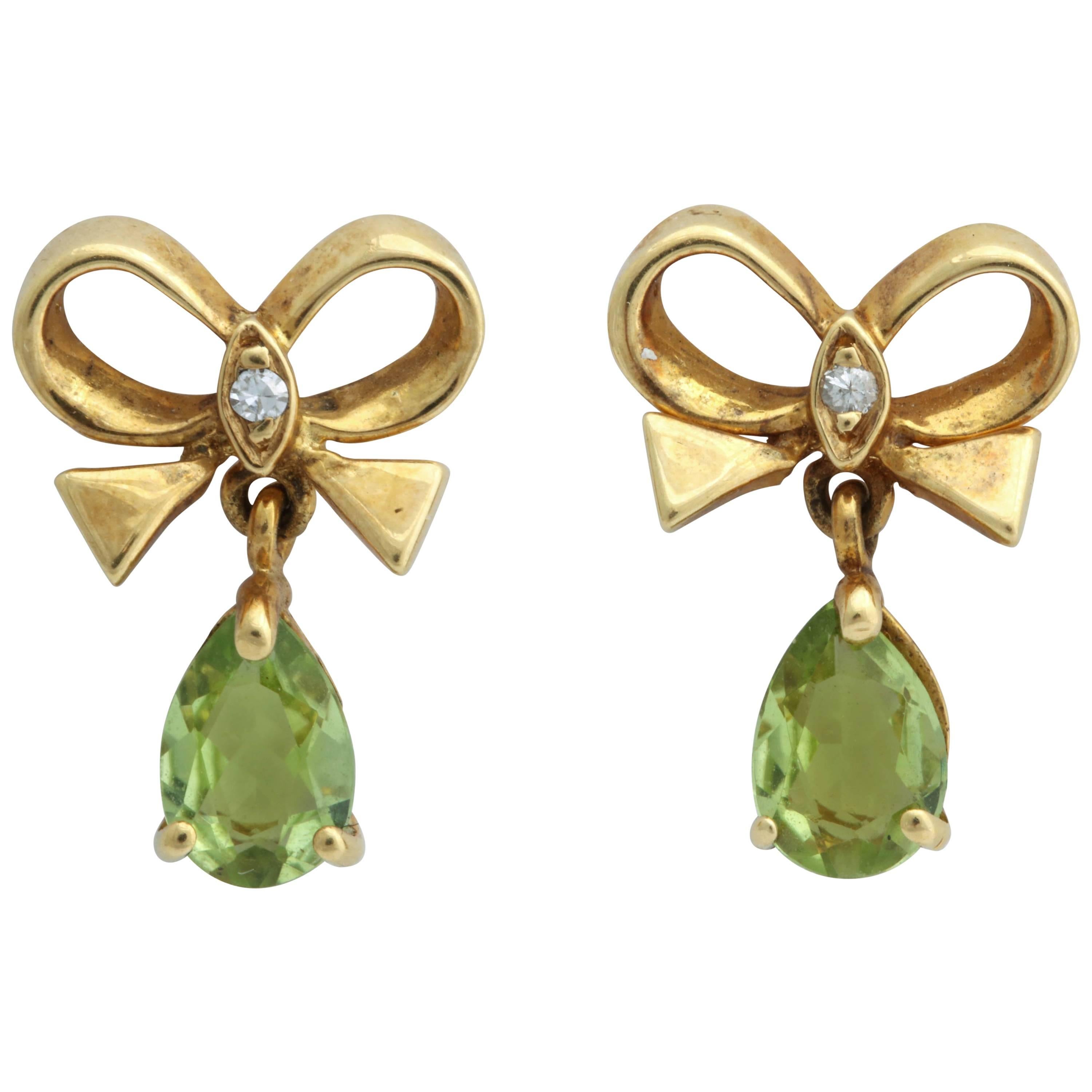 Bow Earrings with Pear Shaped Peridot For Sale