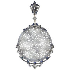 Artistic looking Round Craved Jade Pendant with Diamonds and Sapphire Artistic looking Round Craved Jade Pendant with Diamonds and Sapphire