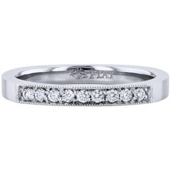 H. H. Anello a fascia con diamante da 0,10 carati in platino