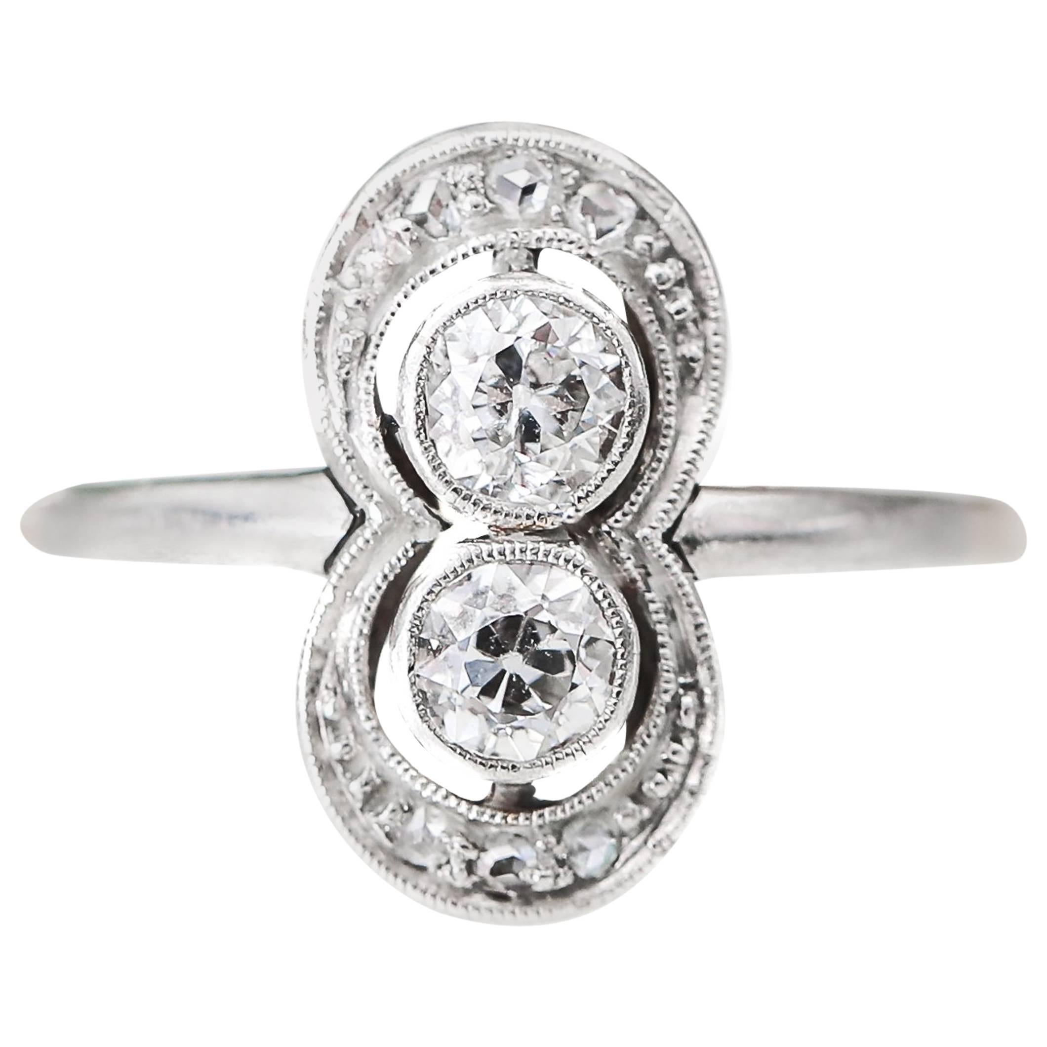 1920s 0.60 Carat Total Weight Diamond Engagement Ring Platinum and 14 Karat Gold