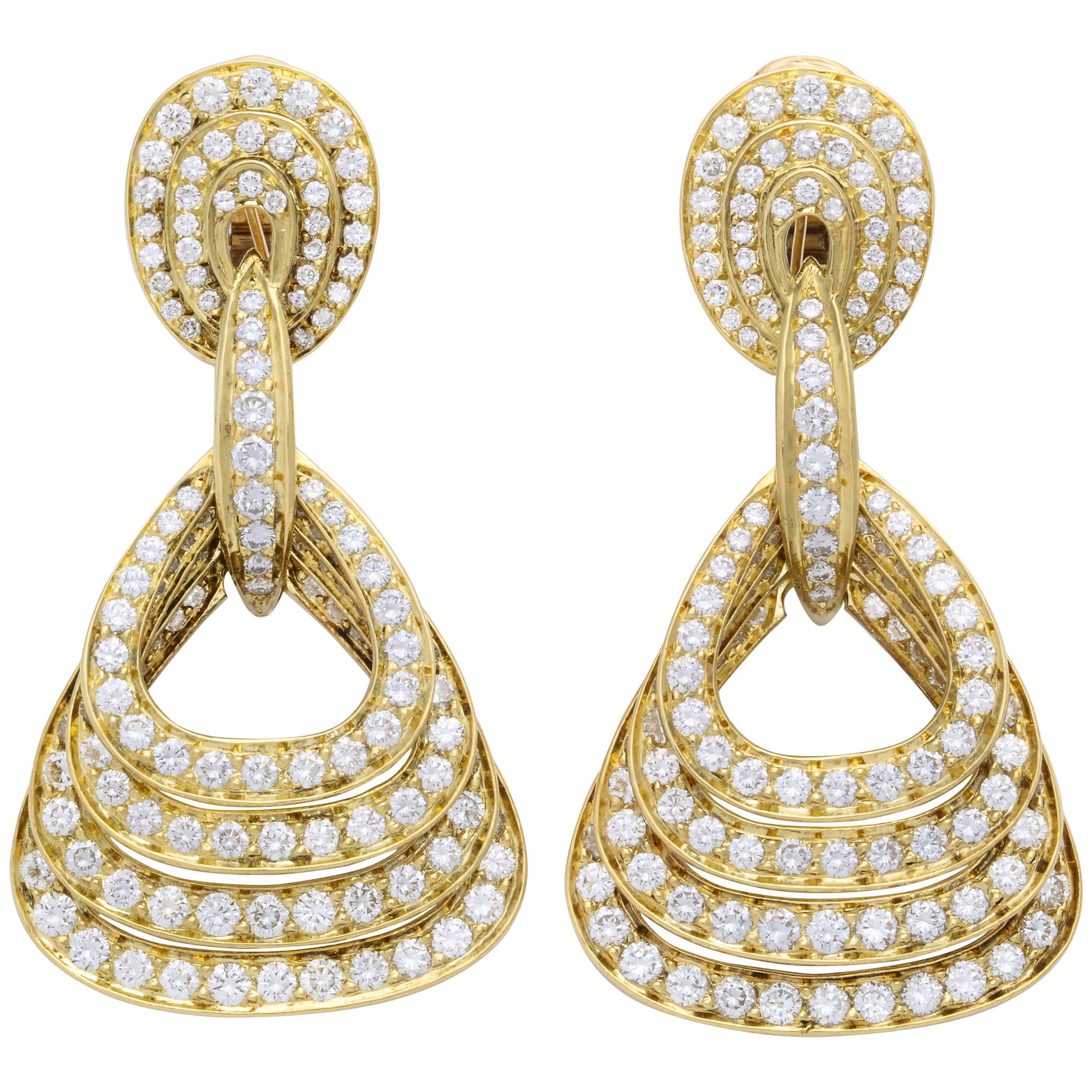 Graduating Quadruple Diamond and 18 Karat Yellow Gold Pendant Earrings For Sale