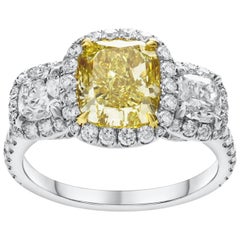GIA Certified Fancy Yellow Diamond Three-Stone Halo Engagement Ring