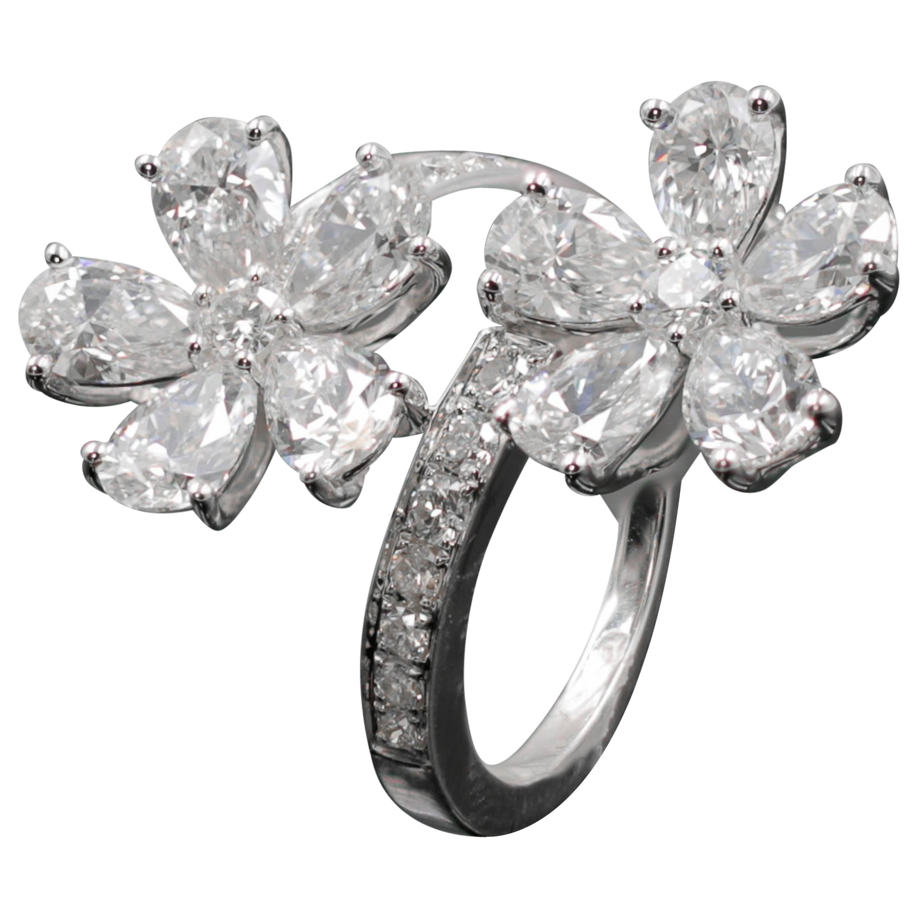 18 Karat Gold Double Flower Ring Featuring 4.77 Carat of Pear Shaped Diamonds For Sale
