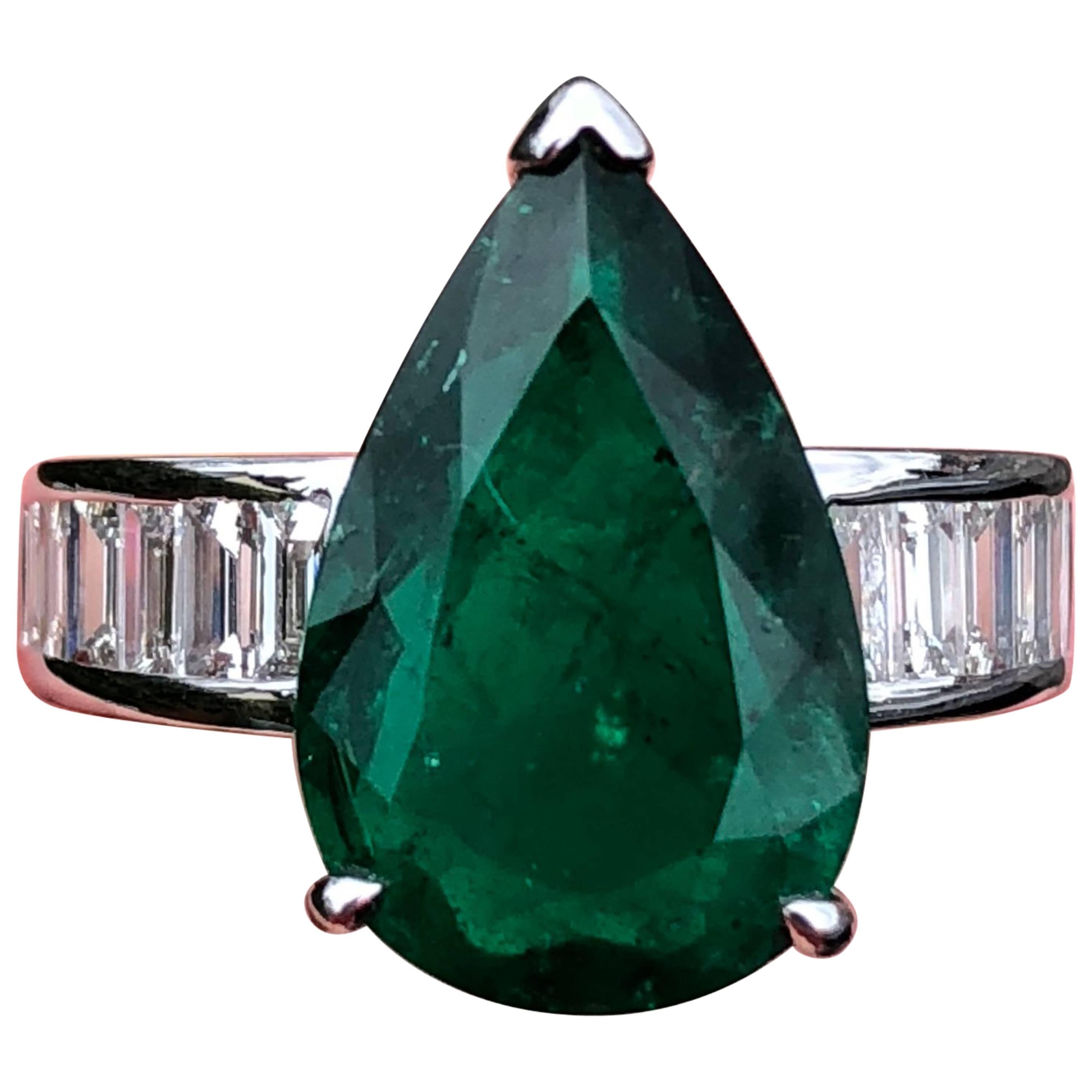 Four Carat Pear Cut, Colombian Emerald Flanked with Diamonds & Set in White Gold For Sale