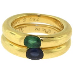 Set of Two Cartier Ellipse 18 Karat Yellow Gold Sapphire and Emerald Rings