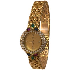 Vintage Baume & Mercier 18K Gold Lady's watch with Diamonds, Rubies, Emeralds, Sapphires