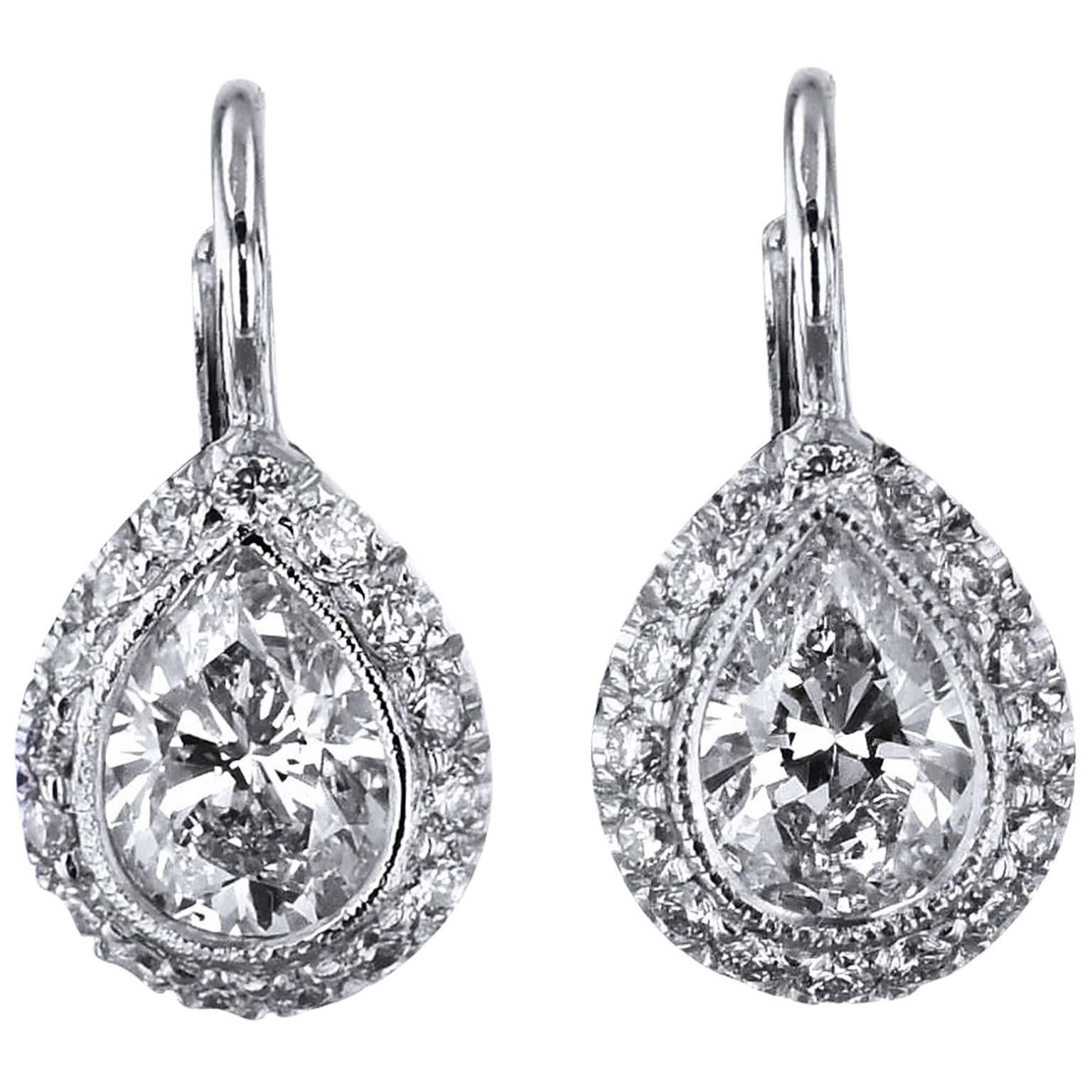 1.06 Carat Pear Shaped and Pave Set Diamonds in 18 kt Gold Lever-Back Earrings