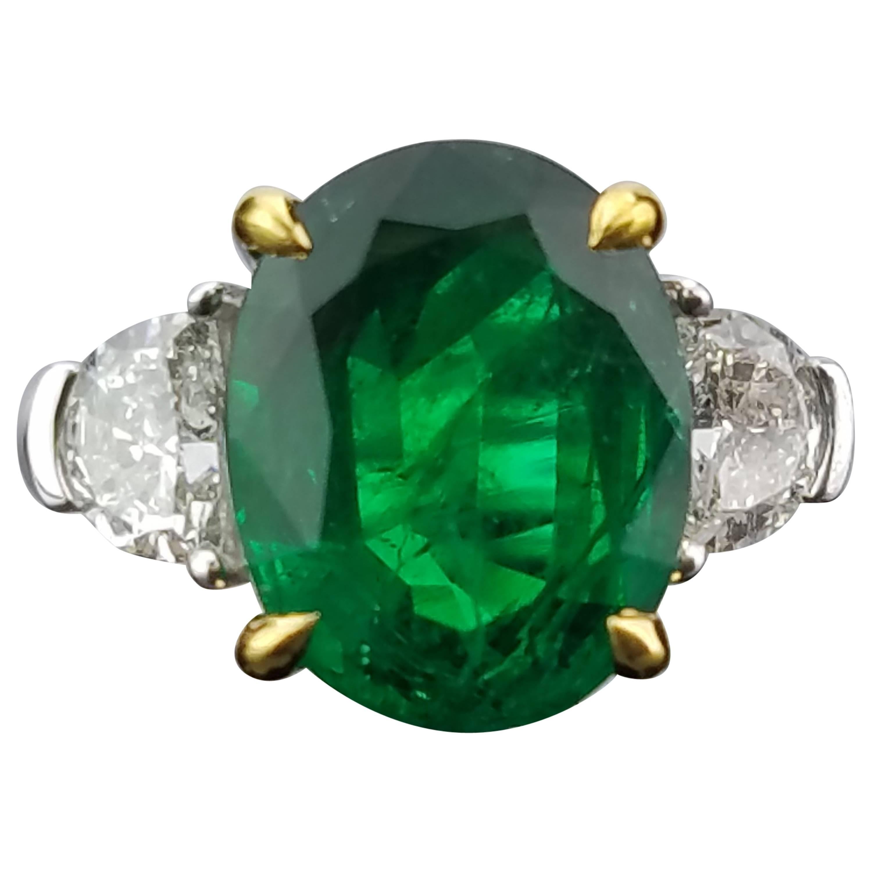 4.9 Carat Oval Shape Emerald and Diamond Three-Stone Ring
