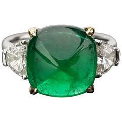 5.06 Carat Emerald Sugarloaf and Diamond Three-Stone Ring