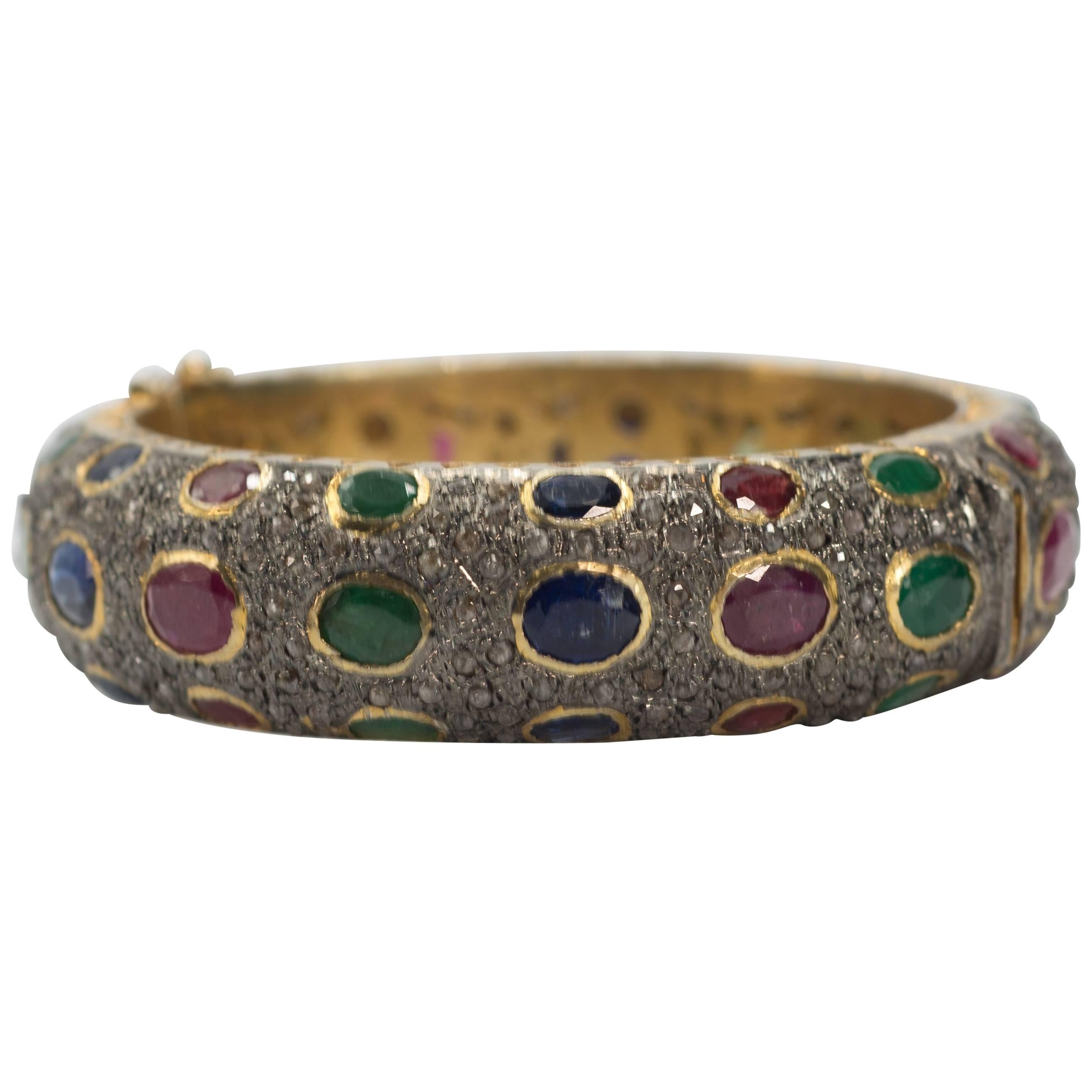 Antique Cut Diamond Emerald Ruby Sapphire Bombe Hinged Vermeil Bangle
fits up to 7'' inch wrist easy to open and close  measures one inch around on the top great fabulous look without looking too dressy.