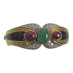 Vintage 18 Karat Yellow Gold, Platinum Bracelet with Diamonds, Onyx and Ruby and Emerald