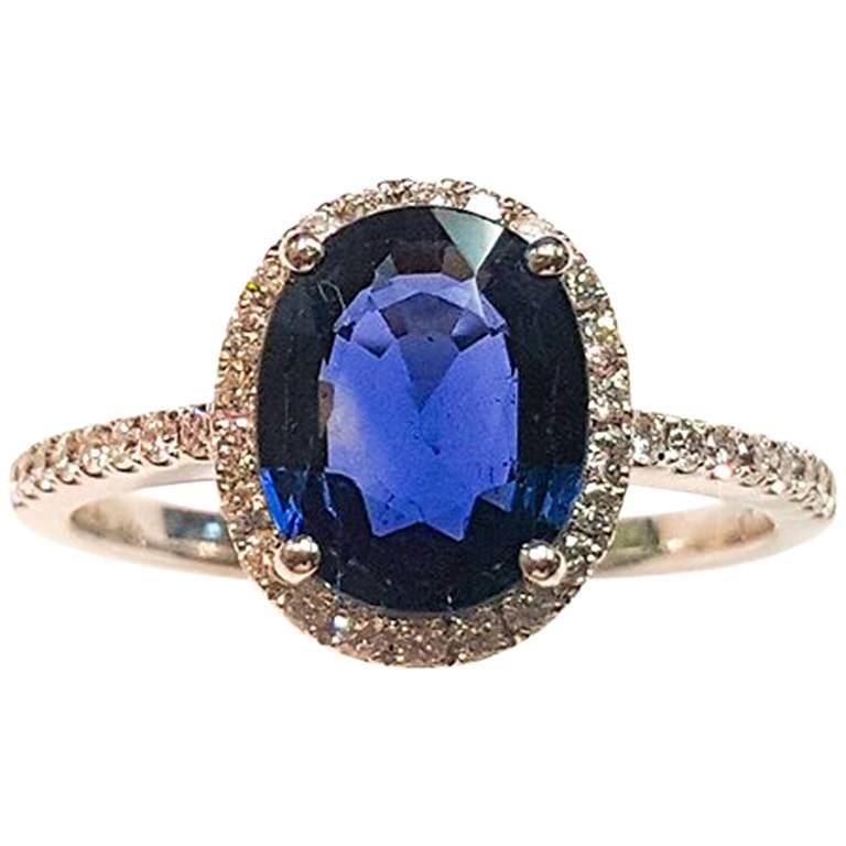 This Ladies 14 Karat White Gold Sapphire and Diamonds Ring For Sale