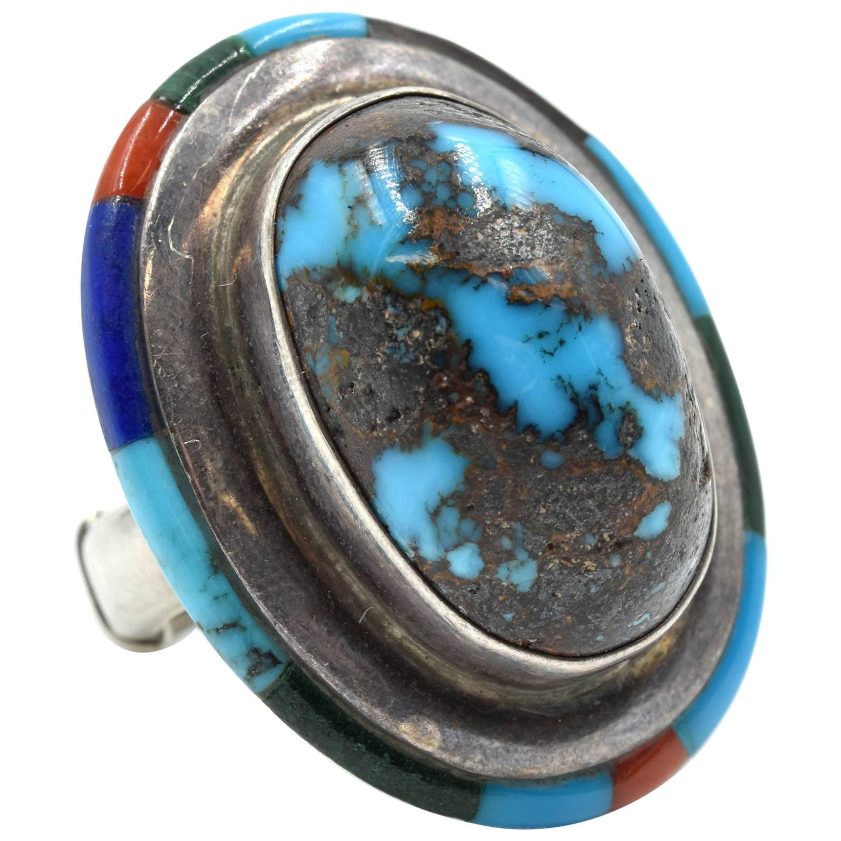 Bague en argent sterling et turquoise avec incrustation de pierres précieuses en vente