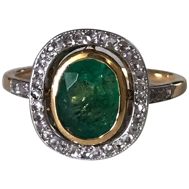 Edwardian Marquise Diamond Engagement Ring with Calibre Emerald Border