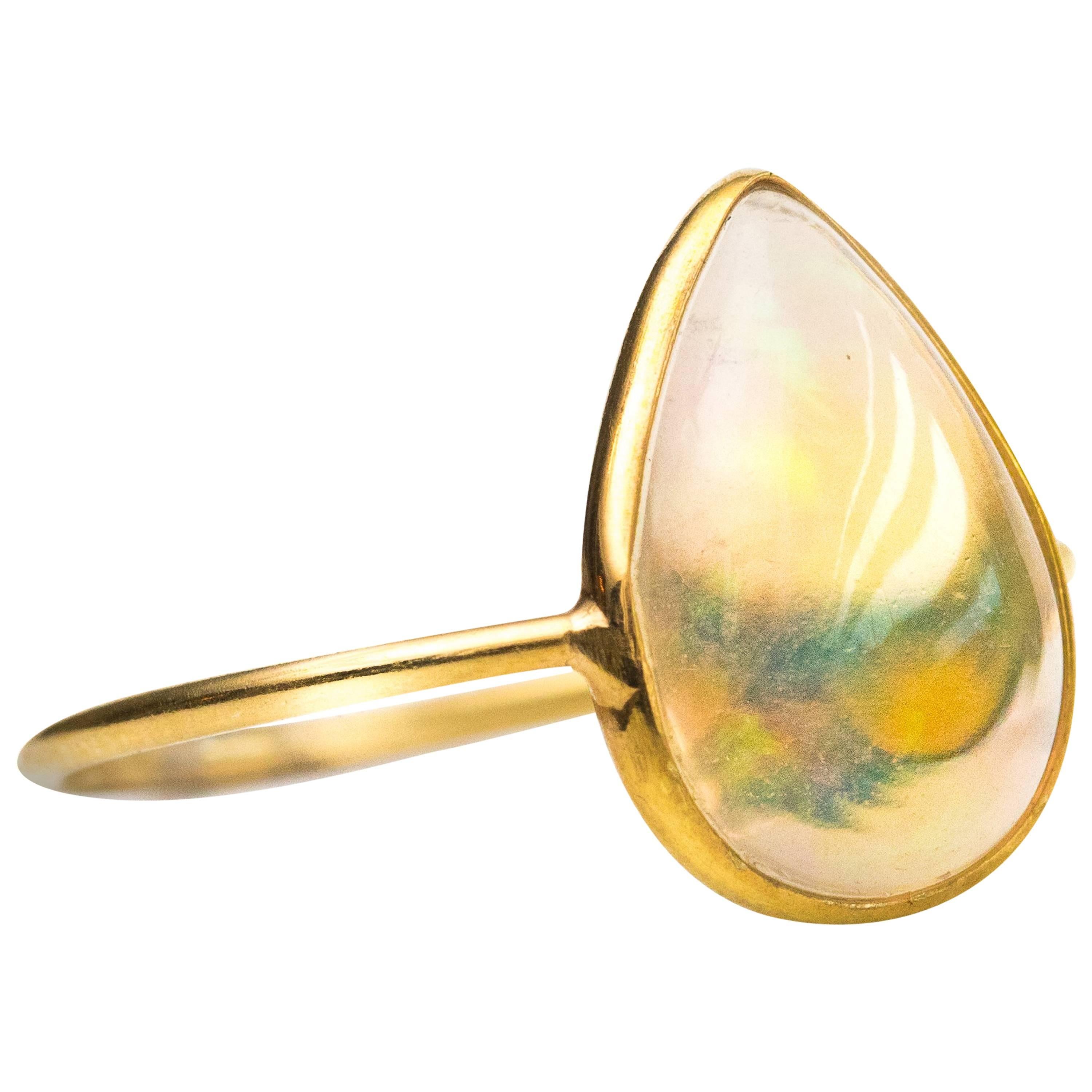 1.5 Carat Pear Cut Ethiopian Opal 18 Karat Yellow Gold Ring For Sale