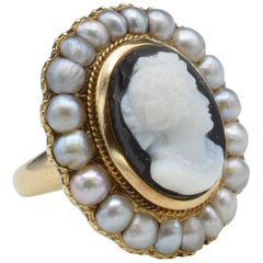 Hand-Carved Onyx Cameo Ring with Pearl Halo from Napoleon III in 18 Karat Gold