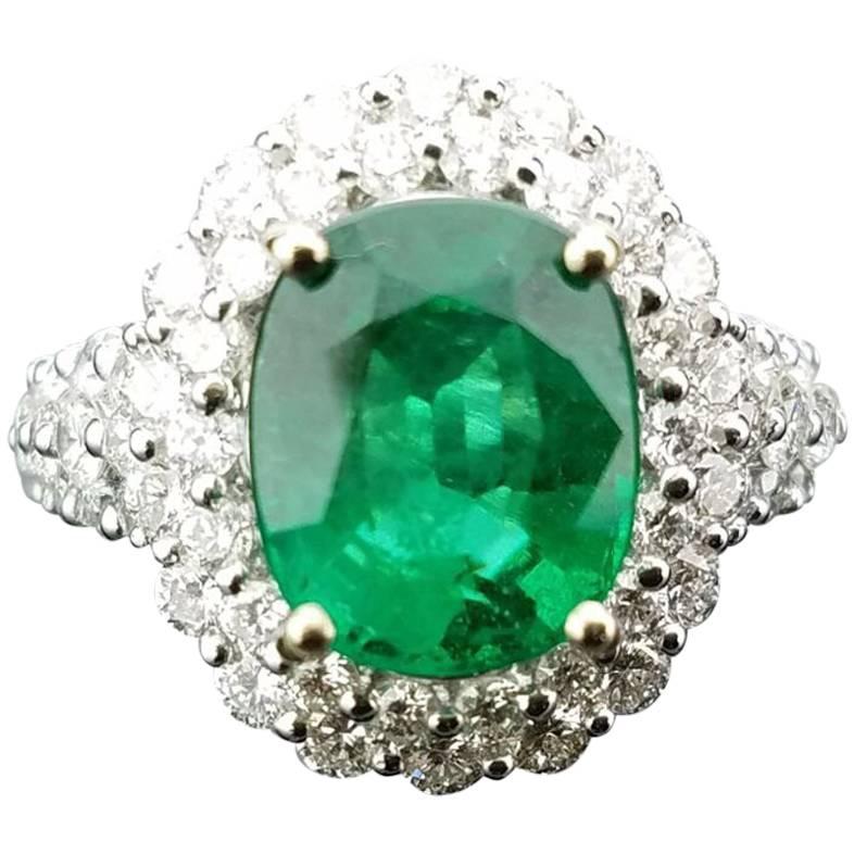 Certified 3.91 Carat Oval Emerald and Diamond Cocktail Ring For Sale