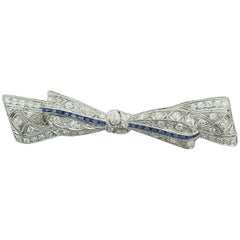 1920s Exquisite Platinum Diamond and Sapphire Bow Brooch