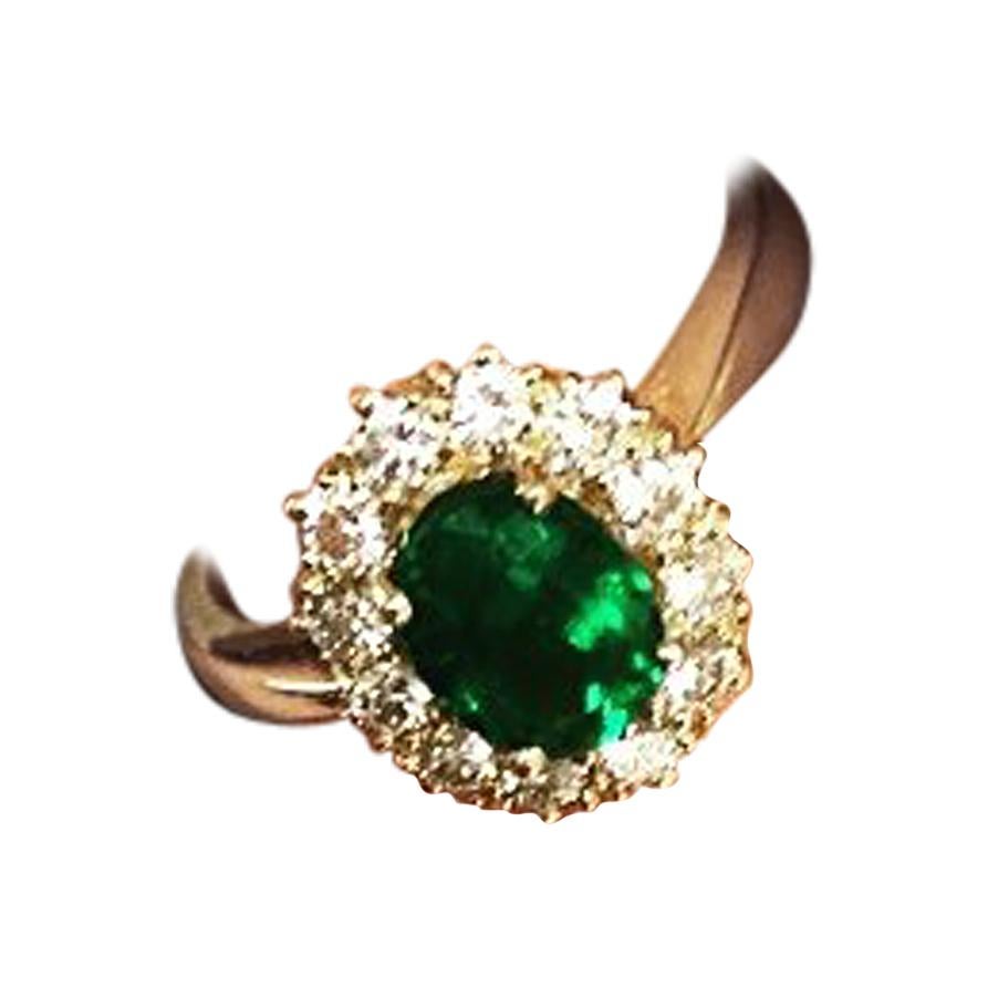 1.03 Carat Oval Cut Colombian Emerald 18 Karat Gold Diamond Halo Engagement Ring For Sale