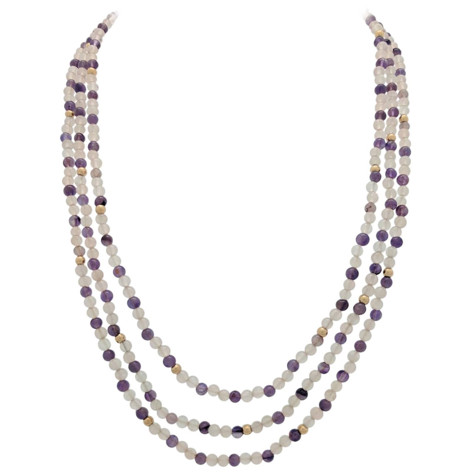 14 Karat Yellow Gold Triple Strand Amethyst and Clear Beaded Necklace