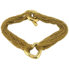 Tiffany & Co. 18 Karat Yellow Gold Bracelet with Heart Charm, circa 2000s