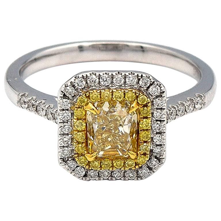 0.97 Carat Radiant Natural Yellow Diamond Ring in 18 Karat White Gold For Sale