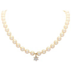 Midcentury White Pearl and 14 Karat Gold Necklace with Diamond Star Pendant