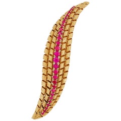 1960s Graduated Ruby and 18 Karat Yellow Gold Brooch by Tiffany & Co.