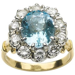 Blue topaz and Diamond Cluster Ring