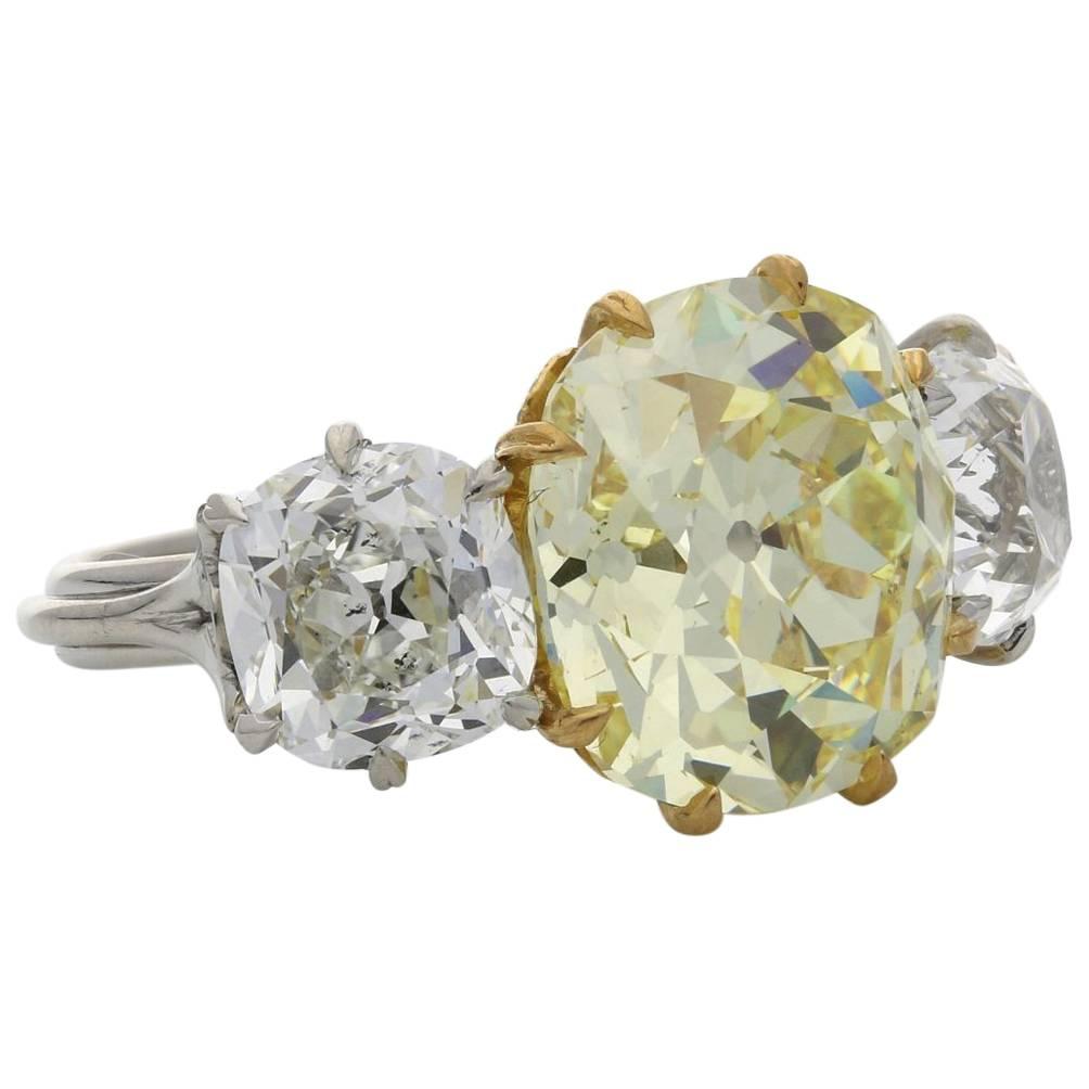Hancocks Three-Stone Diamond and Fancy Intense Yellow Diamond Ring