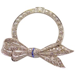 Platinum Diamond and Sapphire Art Deco Circle Bow Brooch