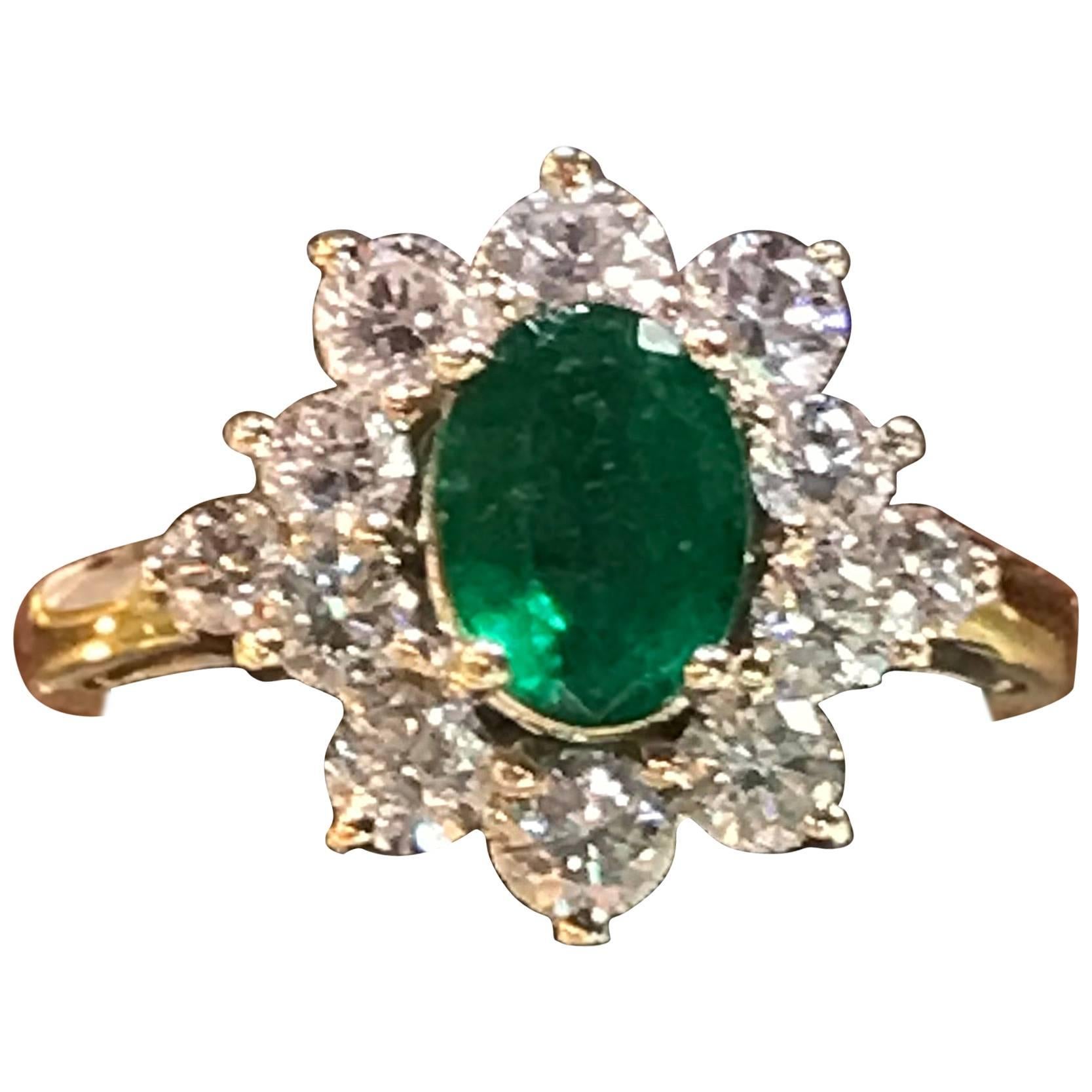 1.56 Oval Cut Emerald with 1.06 Carat of Diamond Cocktail Ring For Sale