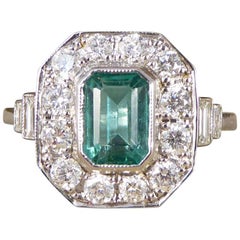 Emerald and Diamond Cluster 18 Carat White Gold Engagement Ring