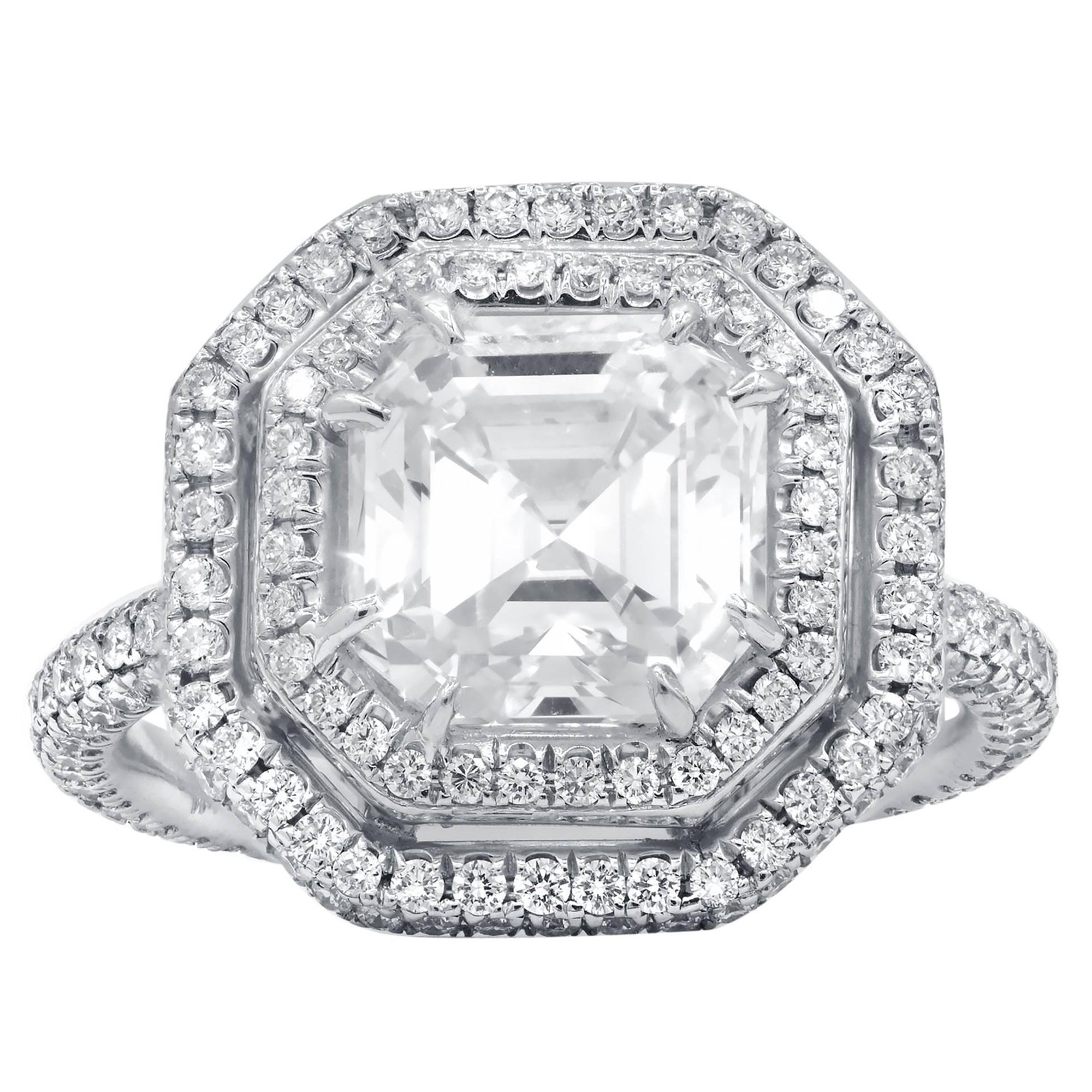 Platinum Custom designed and GIA certified diamond engagement ring with square emerald cut diamond in the center features 3.01 carat I color/VS1 clarity and  set in beautiful double halo setting with 1.40 carats natural round brilliant cut