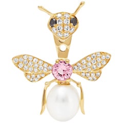 Yvonne Leon's stud and Ear-Jacket in 18K Gold with Diamonds and Pink Sapphire 