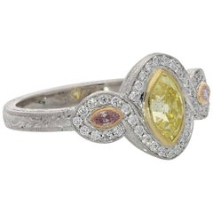 Hancocks Unusual Fancy Yellow and Pink Diamond Ring with Diamond Surround