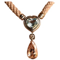 Collier en or blanc avec 1 morganite, 1 aigue-marine et 1 diamant.