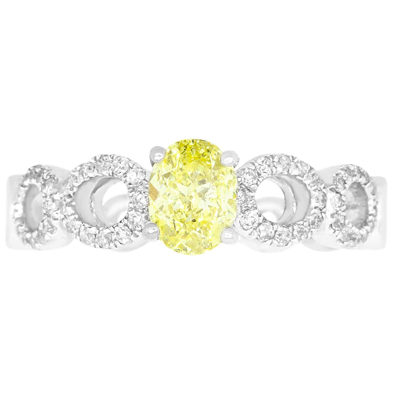 0.71 Carat Oval Cut Yellow Diamond Engagement Ring