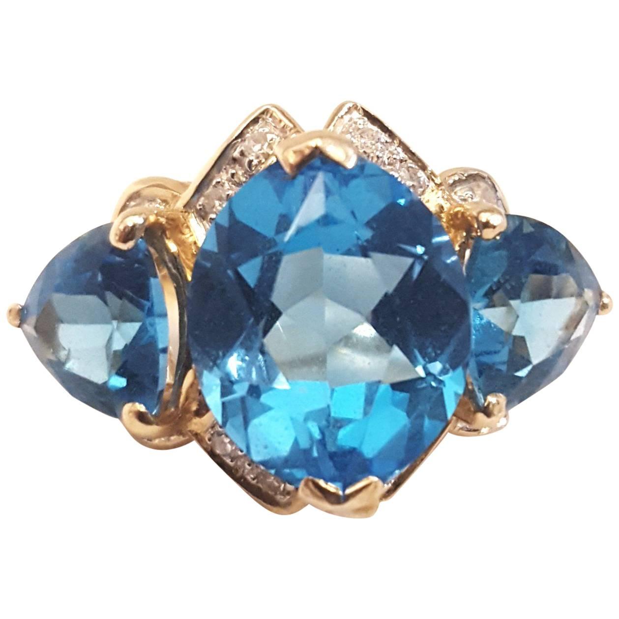 14 Karat Beautiful Blue Topaz and Diamond Ring For Sale
