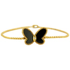 Van Cleef & Arpels, Vintage 18 Karat Gold and Onyx Butterfly Bangle with Diamond