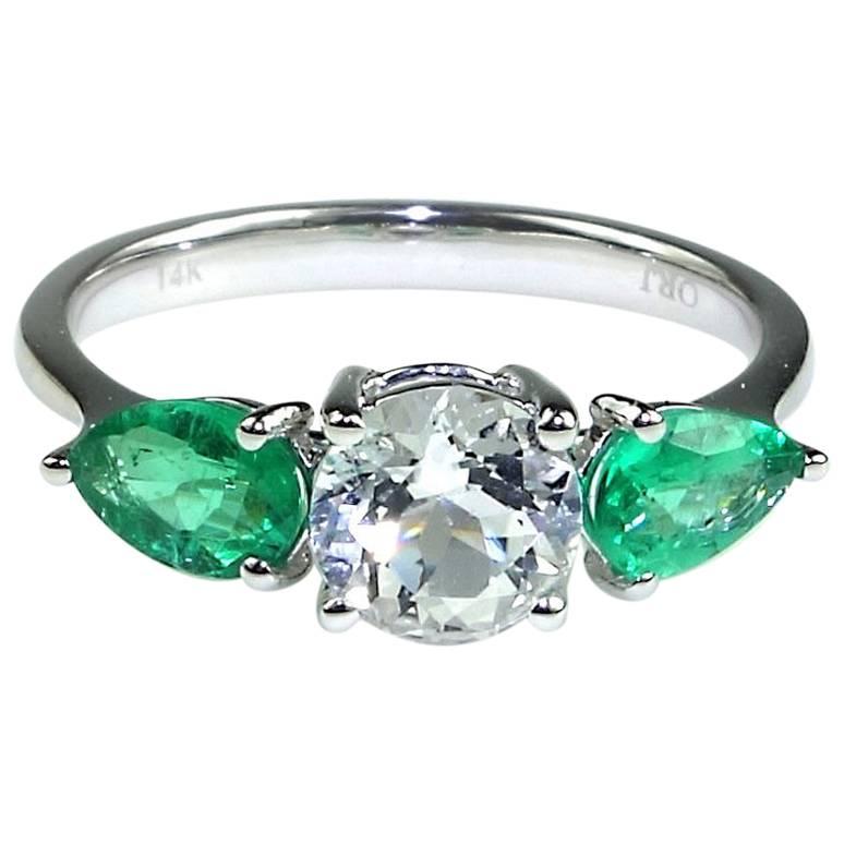 
Great Mother's Day Gift.
Custom made, romantic ring of round, sparkling Silver Topaz and Glittering Pear shape Emeralds. These gemstones come straight from our favorite supplier in the mountains outside of Rio de Janeiro. This classic setting is