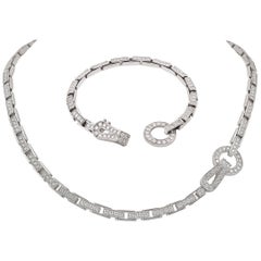 Collier et bracelet 'Agrafe' en or blanc et diamants de Cartier