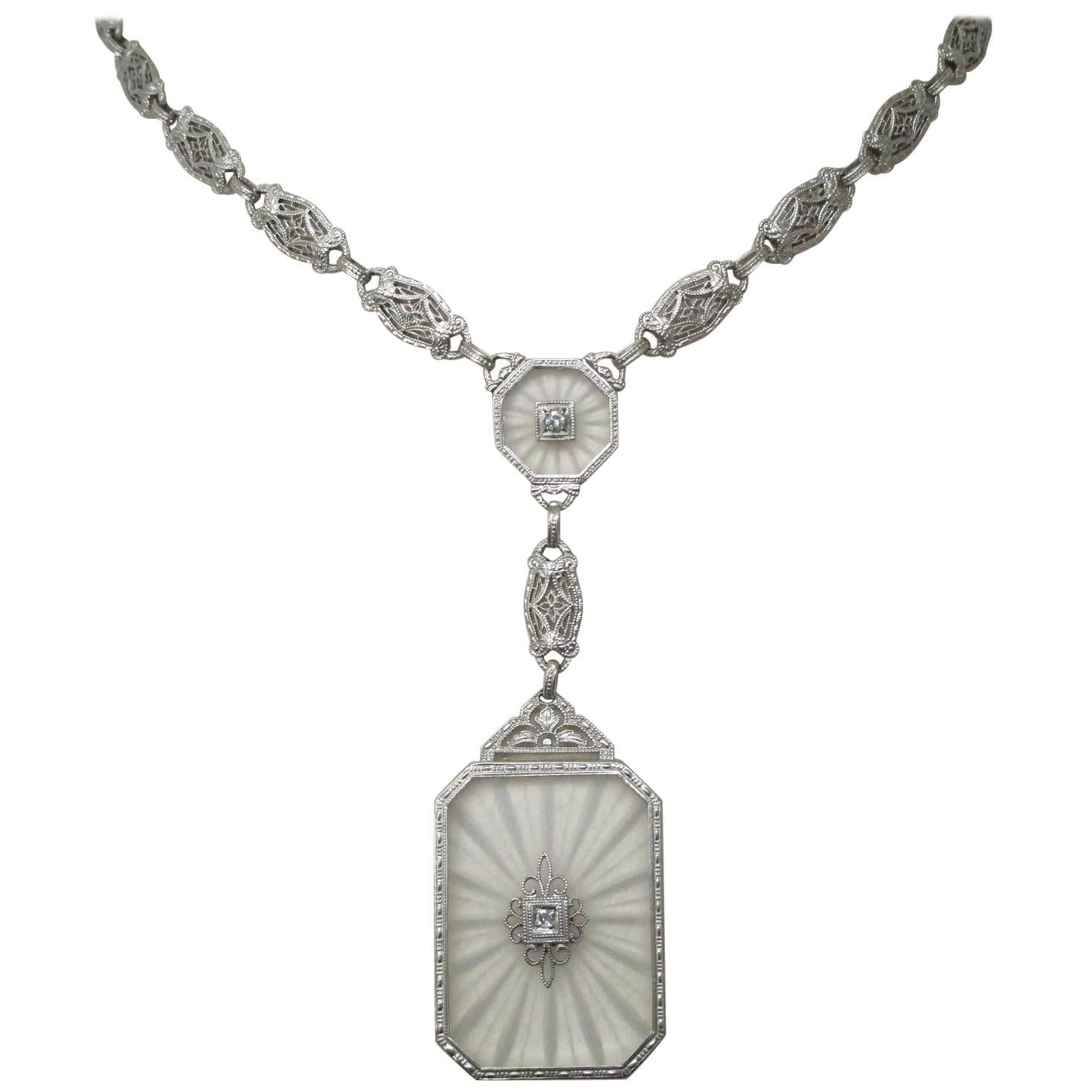 From an age of delicate beauty comes this extraordinary piece of art. Carved quartz, with single cut diamonds at the center of each station, makes this necklace a standout, as most of the jewelry made like this, used glass and rhinestones. You won't