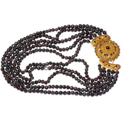 Five-rowed garnet necklace with large 14k rose gold clasp, Bohemian.