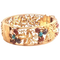 1970s 14 Karat Open Work Bangle Bracelet Opals, Turquoise, Amethyst, Tourmalines
