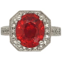 5.06 Carat Oval Cut Spessertite Garnet and Diamond Ring set in 18 Karat Gold
