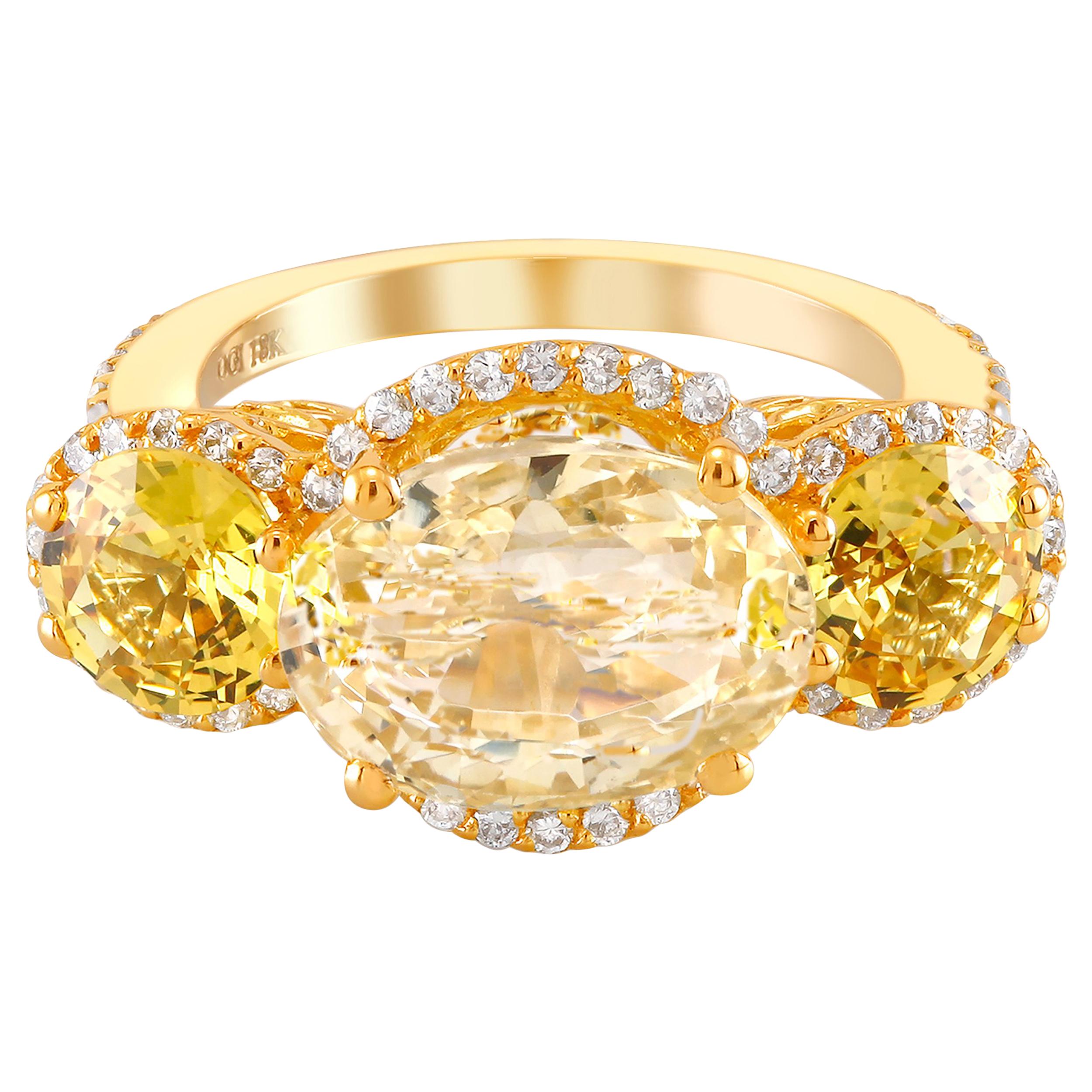 One of a Kind 18k yellow gold cocktail ring 
Yellow Sapphire weighing 5.72 carats 
GIA Yellow Sapphire no indication of heating
Geographic Origin Sri Lanka
GIA Certificate #2195471074
Matched pair of round yellow sapphire Sapphire weighing 2.06