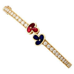 1980s Vintage French 1.05 Carat Ruby 2.16 Carat Diamond and Sapphire Gold Bangle