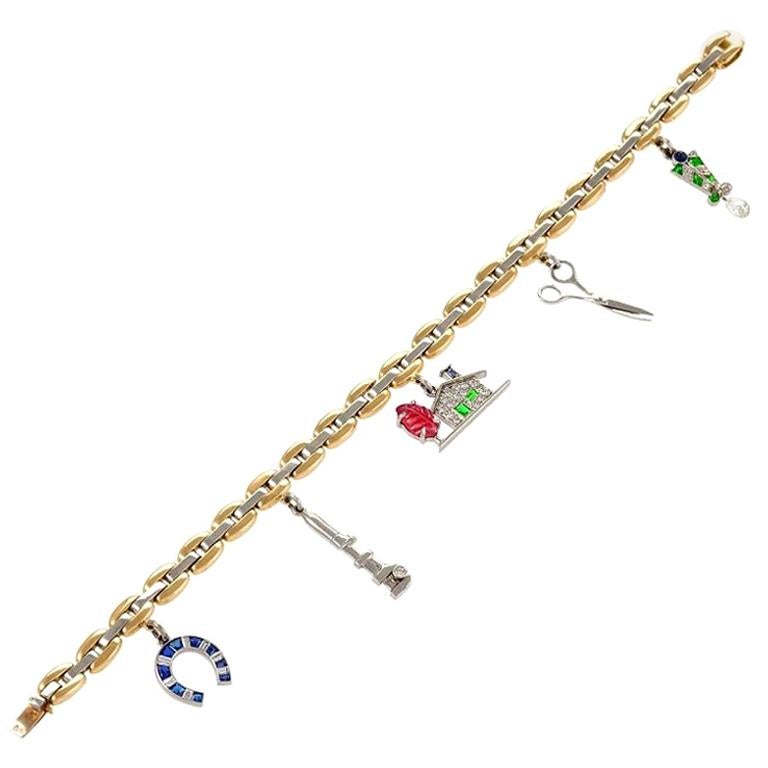 Cartier Charm-Armband aus Gold, Platin, Diamanten, Saphiren, Rubinen und Smaragden